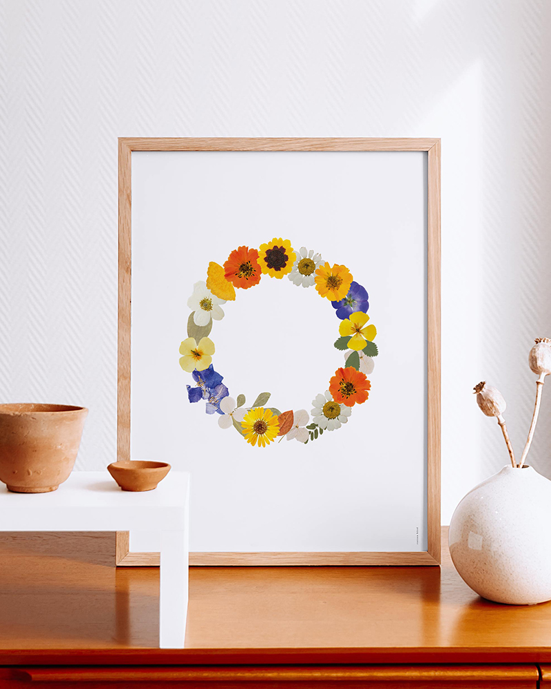 Affiche déco d'une couronne de fleurs colorées.